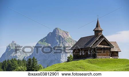 Stock Image - "Stoos-Kirche church in front of Grosser Mythen mountain, Stoos, Morschach, canton of Schwyz, Switzerland, Europe". Fotosearch