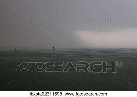 "Stormy sky with rain over Lake Constance near Konstanz, Baden-Wuerttemberg, Germany, Europe" View Large Photo Image Stock Photo - "Stormy sky with rain over Lake Constance near Konstanz, Baden-Wuerttemberg, Germany, Europe". Fotosearch
