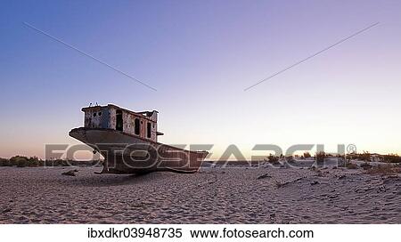 "Stranded ship at the port of MoÊ»ynoq or Muinak, Aral Sea, Karakalpakstan, Uzbekistan, Asia" View Large Photo Image Stock Photography - "Stranded ship at the port of MoÊ»ynoq or Muinak, Aral Sea, Karakalpakstan, Uzbekistan, Asia". Fotosearch