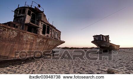 "Stranded ships at the port of MoÊ»ynoq or Muinak, Aral Sea, Karakalpakstan, Uzbekistan, Asia" View Large Photo Image Stock Photo - "Stranded ships at the port of MoÊ»ynoq or Muinak, Aral Sea, Karakalpakstan, Uzbekistan, Asia". Fotosearch