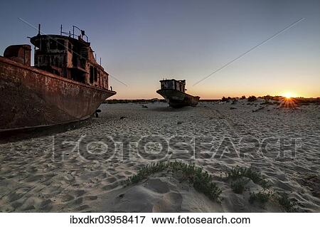 "Stranded ships at the port of MoÊ»ynoq or Muinak, Aral Sea, Karakalpakstan, Uzbekistan, Asia" View Large Photo Image Stock Photo - "Stranded ships at the port of MoÊ»ynoq or Muinak, Aral Sea, Karakalpakstan, Uzbekistan, Asia". Fotosearch