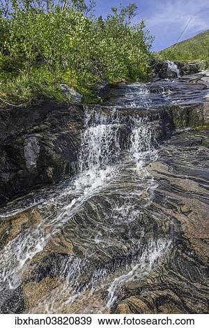 Stock Photo - "Streambed with rock structures, at Mt Keipen, Senja Island, Troms, Norway, Europe". Fotosearch