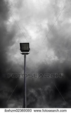 Street lamp in front of a cloudy sky View Large Photo Image Stock Image - Street lamp in front of a cloudy sky. Fotosearch