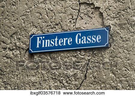 Stock Photo - "Street sign Finstere Gasse or Dark Alley, Munnerstadt, Lower Franconia, Bavaria, Germany, Europe". Fotosearch