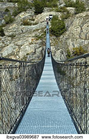 "Stressed-ribbon bridge across Massa Gorge, Belalp tourism region, Canton of Valais, Switzerland, Europe" View Large Photo Image Stock Photo - "Stressed-ribbon bridge across Massa Gorge, Belalp tourism region, Canton of Valais, Switzerland, Europe". Fotosearch