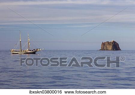 "Strombolicchio island with sailboat, Stromboli, Sicily, Italy, Europe" View Large Photo Image Stock Photograph - "Strombolicchio island with sailboat, Stromboli, Sicily, Italy, Europe". Fotosearch