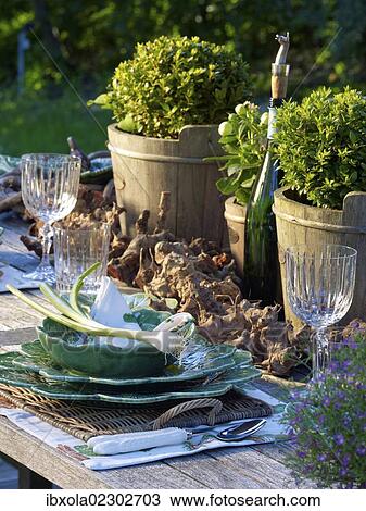 Stylishly laid rustic wooden garden table with fine bone china View Large Photo Image Stock Image - Stylishly laid rustic wooden garden table with fine bone china. Fotosearch
