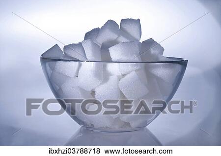 Stock Photo - Sugar cubes in a glass bowl. Fotosearch