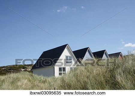 "Summer cottages, several coloured wooden houses in the dunes, Hornum, Sylt, Schleswig-Holstein, Germany, Europe" View Large Photo Image Stock Photography - "Summer cottages, several coloured wooden houses in the dunes, Hornum, Sylt, Schleswig-Holstein, Germany, Europe". Fotosearch