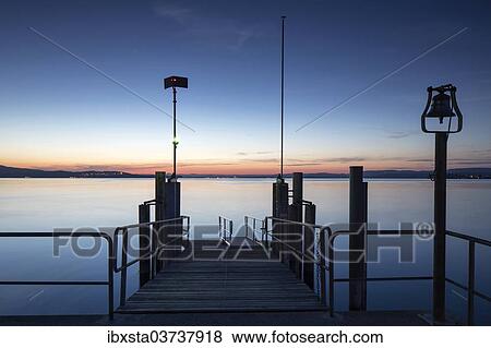 "Summer evening mood, boat pier on Lake Constance, Lake Constance, Mannenbach, Canton of Thurgau, Switzerland, Europe" View Large Photo Image Stock Photo - "Summer evening mood, boat pier on Lake Constance, Lake Constance, Mannenbach, Canton of Thurgau, Switzerland, Europe". Fotosearch