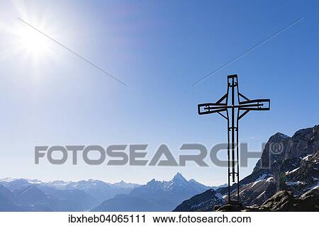 "Summit cross, Mt Kleiner Heubergkopf, 1508m, Mt Watzmann at the centre, Mt Steinernes Meer on the left, Mt Berchtesgadener Hochthron on the right, Berchtesgaden, Bavaria, Germany, Europe" View Large Photo Image Stock Image - "Summit cross, Mt Kleiner Heubergkopf, 1508m, Mt Watzmann at the centre, Mt Steinernes Meer on the left, Mt Berchtesgadener Hochthron on the right, Berchtesgaden, Bavaria, Germany, Europe". Fotosearch