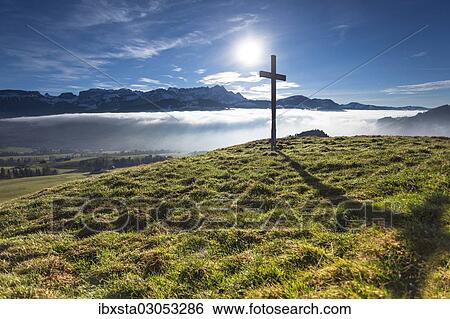 "Summit cross of Gerenberg Mountain with high fog in front of the Alpstein Mountains, Gerenberg, Appenzell, Switzerland, Europe" View Large Photo Image Stock Photograph - "Summit cross of Gerenberg Mountain with high fog in front of the Alpstein Mountains, Gerenberg, Appenzell, Switzerland, Europe". Fotosearch