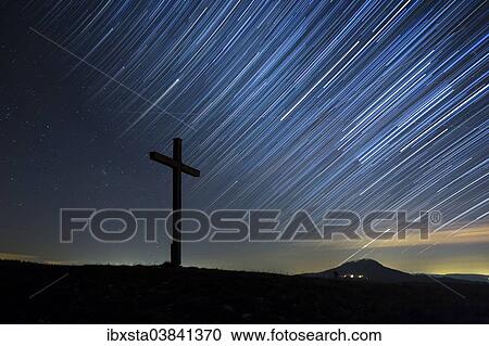 "Summit cross on Bisberg Mountain with a starry sky, Hohenhewen Mountain at the back, Tengen, Watterdingen, Hegau, Baden-Wurttemberg, Germany, Europe" View Large Photo Image Stock Image - "Summit cross on Bisberg Mountain with a starry sky, Hohenhewen Mountain at the back, Tengen, Watterdingen, Hegau, Baden-Wurttemberg, Germany, Europe". Fotosearch