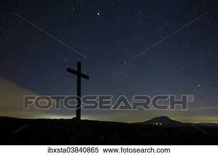 "Summit cross on Bisberg Mountain with a starry sky, Hohenhewen Mountain at the back, Tengen, Watterdingen, Hegau, Baden-Wurttemberg, Germany, Europe" View Large Photo Image Stock Photography - "Summit cross on Bisberg Mountain with a starry sky, Hohenhewen Mountain at the back, Tengen, Watterdingen, Hegau, Baden-Wurttemberg, Germany, Europe". Fotosearch
