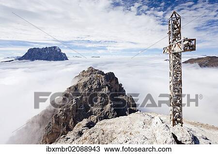 "Summit cross on Gran Cir Mountain, using the climbing route above Gardena, overlooking Val Gardena, with Sassolungo Mountain at the rear, Dolomites, Alto Adige, Italy, Europe" View Large Photo Image Stock Image - "Summit cross on Gran Cir Mountain, using the climbing route above Gardena, overlooking Val Gardena, with Sassolungo Mountain at the rear, Dolomites, Alto Adige, Italy, Europe". Fotosearch