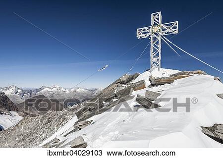 "Summit cross on the Hohe Weisszint, on the border, Zillertal Alps, Lappach Muhlwaldertal, Campo Tures, Puster Valley, Province of South Tyrol, Italy, Alps, Finkenberg, Tyrol, Austria, Europe" View Large Photo Image Stock Image - "Summit cross on the Hohe Weisszint, on the border, Zillertal Alps, Lappach Muhlwaldertal, Campo Tures, Puster Valley, Province of South Tyrol, Italy, Alps, Finkenberg, Tyrol, Austria, Europe". Fotosearch