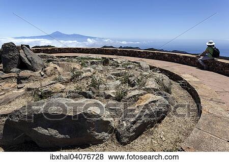 "Summit of Garajonay with a view of Passat clouds and the Teide on Tenerife, La Gomera, Canary Islands, Spain, Europe" View Large Photo Image Stock Photo - "Summit of Garajonay with a view of Passat clouds and the Teide on Tenerife, La Gomera, Canary Islands, Spain, Europe". Fotosearch