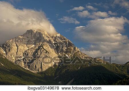 "Summit of Gruenstein Mountain in the evening light, Mieminger Chain, Ehrwald, Tyrol, Austria, Europe" View Large Photo Image Stock Photo - "Summit of Gruenstein Mountain in the evening light, Mieminger Chain, Ehrwald, Tyrol, Austria, Europe". Fotosearch