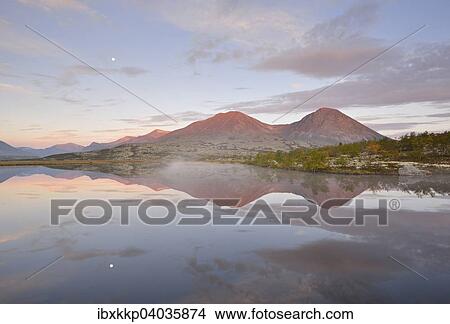 "Summits of the Stygghoin or Stygghoin mountains, reflected in the lake Doralstjornin or Doralstjornin, Rondane National Park, Norway, Europe" View Large Photo Image Picture - "Summits of the Stygghoin or Stygghoin mountains, reflected in the lake Doralstjornin or Doralstjornin, Rondane National Park, Norway, Europe". Fotosearch