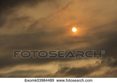 "Sun behind clouds and brownish ash and gas clouds of the Holuhraun fissure eruption, north of the Baroarbunga volcano, highlands of Iceland, Northeastern Region, Iceland, Europe" View Large Photo Image Stock Photo - "Sun behind clouds and brownish ash and gas clouds of the Holuhraun fissure eruption, north of the Baroarbunga volcano, highlands of Iceland, Northeastern Region, Iceland, Europe". Fotosearch