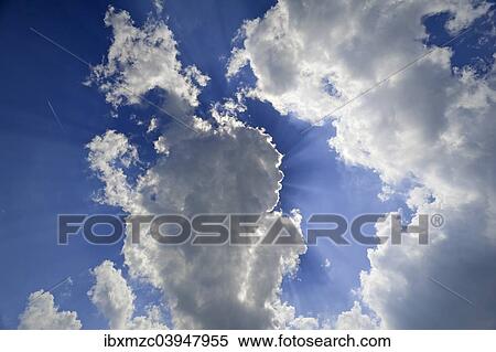 Sun hiding behind clouds in the sky View Large Photo Image Stock Photography - Sun hiding behind clouds in the sky. Fotosearch