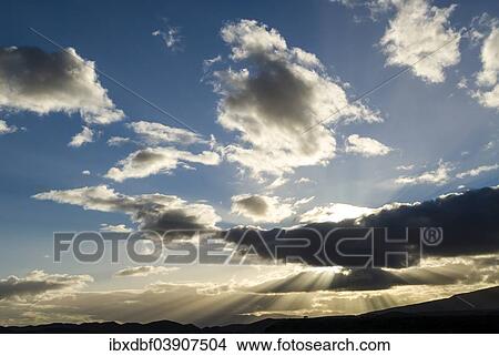 "Sun rays breaking through the clouds in the evening light, near Barrydale, Route 62, Western Cape, South Africa, Africa" View Large Photo Image Picture - "Sun rays breaking through the clouds in the evening light, near Barrydale, Route 62, Western Cape, South Africa, Africa". Fotosearch