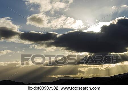 "Sun rays breaking through the clouds in the evening light, near Barrydale, Route 62, Western Cape, South Africa, Africa" View Large Photo Image Stock Image - "Sun rays breaking through the clouds in the evening light, near Barrydale, Route 62, Western Cape, South Africa, Africa". Fotosearch