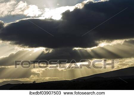 "Sun rays breaking through the clouds in the evening light, near Barrydale, Route 62, Western Cape, South Africa, Africa" View Large Photo Image Stock Image - "Sun rays breaking through the clouds in the evening light, near Barrydale, Route 62, Western Cape, South Africa, Africa". Fotosearch