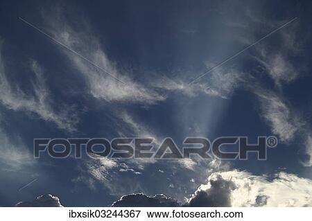 "Sun rays through a cloudy sky, Upper Swabia, Baden-Wurttemberg, Germany, Europe" View Large Photo Image Stock Photo - "Sun rays through a cloudy sky, Upper Swabia, Baden-Wurttemberg, Germany, Europe". Fotosearch