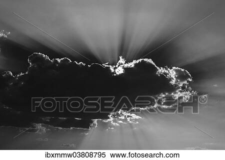 Stock Photography - "Sun shining behind a cloud, Etosha National Park, Namibia, Africa". Fotosearch
