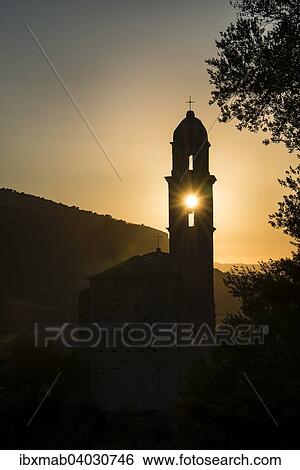 "Sun shining through a belfry, silhouette of a church tower, evening mood, sunset, Haute-Corse, Corsica, France, Europe" View Large Photo Image Stock Photograph - "Sun shining through a belfry, silhouette of a church tower, evening mood, sunset, Haute-Corse, Corsica, France, Europe". Fotosearch