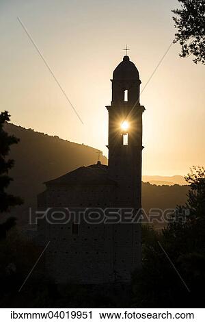 "Sun shining through bell tower, silhouette of a church tower, evening mood, Haute-Corse, Corsica, France, Europe" View Large Photo Image Stock Image - "Sun shining through bell tower, silhouette of a church tower, evening mood, Haute-Corse, Corsica, France, Europe". Fotosearch