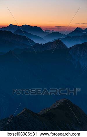Stock Image - "Sunrise above the peaks of the Allgau Alps in steplike arrangement, Oberstdorf, Bavaria, Germany, Europe". Fotosearch