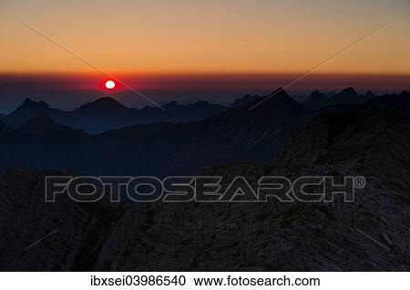 Stock Image - "Sunrise above the peaks of the Allgau Alps, Oberstdorf, Bavaria, Germany, Europe". Fotosearch