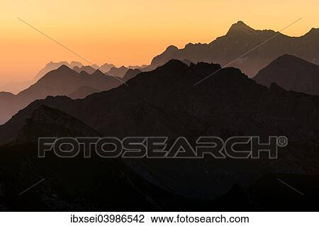 "Sunrise above the peaks of the Allgau Alps in steplike arrangement, Oberstdorf, Bavaria, Germany, Europe" View Large Photo Image Stock Image - "Sunrise above the peaks of the Allgau Alps in steplike arrangement, Oberstdorf, Bavaria, Germany, Europe". Fotosearch
