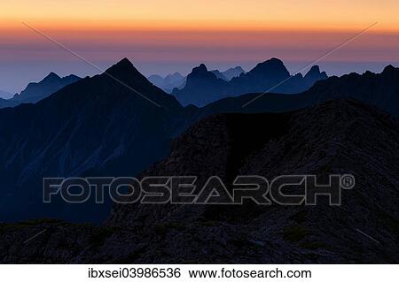 "Sunrise above the peaks of the Allgau Alps in steplike arrangement, Oberstdorf, Bavaria, Germany, Europe" View Large Photo Image Stock Photograph - "Sunrise above the peaks of the Allgau Alps in steplike arrangement, Oberstdorf, Bavaria, Germany, Europe". Fotosearch