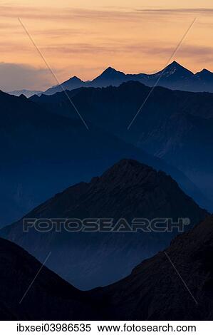 "Sunrise above the peaks of the Allgau Alps in steplike arrangement, Oberstdorf, Bavaria, Germany, Europe" View Large Photo Image Stock Photography - "Sunrise above the peaks of the Allgau Alps in steplike arrangement, Oberstdorf, Bavaria, Germany, Europe". Fotosearch