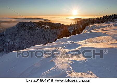 Stock Photo - "Sunrise and a snow edge, Hornisgrinde, Black Forest, Baden-Wuerttemberg, Germany, Europe". Fotosearch