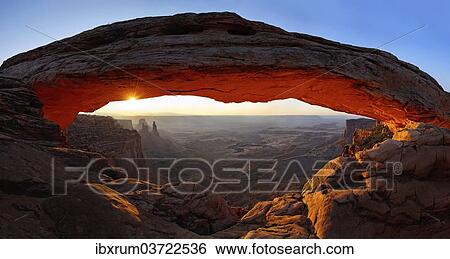 Stock Photograph - "Sunrise at Mesa Arch stone arch, Canyonlands National Park, near Moab, Utah, United States, North America". Fotosearch