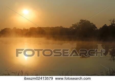 "Sunrise, autumn fog over Big Rock Lake near Detroit Lakes, Minnesota, USA" View Large Photo Image Stock Photo - "Sunrise, autumn fog over Big Rock Lake near Detroit Lakes, Minnesota, USA". Fotosearch