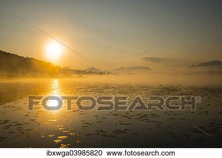 "Sunrise, Hopfensee Lake, near Fussen, Ostallgau, Allgau, Upper Swabia, Swabia, Bavaria, Germany, Europe" View Large Photo Image Stock Image - "Sunrise, Hopfensee Lake, near Fussen, Ostallgau, Allgau, Upper Swabia, Swabia, Bavaria, Germany, Europe". Fotosearch