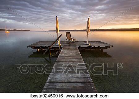 Stock Photograph - "Sunrise, jetty, Lake Starnberg at Seeshaupt, Bavaria, Germany, Europe, PublicGround, Europe". Fotosearch