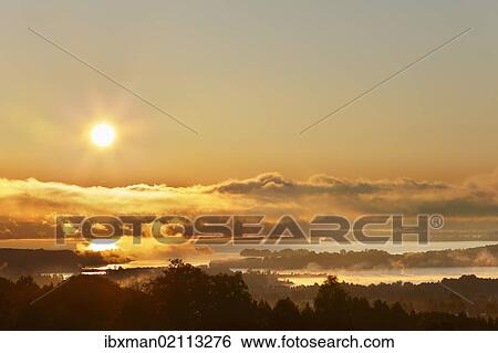 "Sunrise on lake Chiemsee, view from Ratzinger Hoehe, Chiemgau, Upper Bavaria, Bavaria, Germany, Europe" View Large Photo Image Stock Photograph - "Sunrise on lake Chiemsee, view from Ratzinger Hoehe, Chiemgau, Upper Bavaria, Bavaria, Germany, Europe". Fotosearch