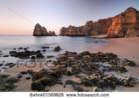 "Sunrise on the beach, Lagos, Algarve, Portugal, Europe" View Large Photo Image Stock Photo - "Sunrise on the beach, Lagos, Algarve, Portugal, Europe". Fotosearch
