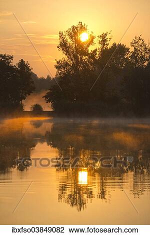 "Sunrise over a pond, Herbsleben, Thuringia, Germany, Europe" View Large Photo Image Stock Image - "Sunrise over a pond, Herbsleben, Thuringia, Germany, Europe". Fotosearch