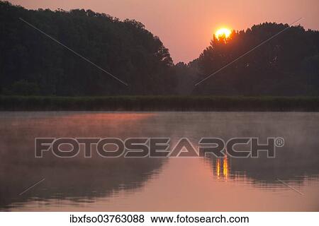 "Sunrise over a pond landscape, Herbsleben, Thuringia, Germany, Europe" View Large Photo Image Stock Photo - "Sunrise over a pond landscape, Herbsleben, Thuringia, Germany, Europe". Fotosearch