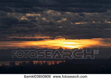 "Sunrise over the Alps with Foehn clouds, western Lake Constance at the front, Baden-Wurttemberg, Germany, Europe" View Large Photo Image Stock Photograph - "Sunrise over the Alps with Foehn clouds, western Lake Constance at the front, Baden-Wurttemberg, Germany, Europe". Fotosearch