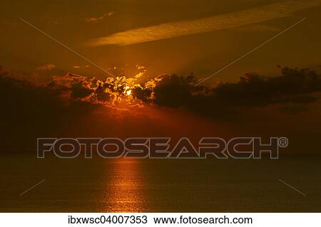 Stock Image - "Sunrise over the sea, Rugen Island, Mecklenburg-Western Pomerania, Germany, Europe". Fotosearch