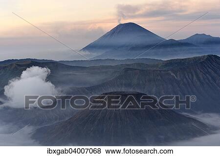 "Sunrise over the smoking Gunung Bromo volcano, Bromo-Tengger-Semeru National Park, Java, Indonesia, Asia" View Large Photo Image Stock Photo - "Sunrise over the smoking Gunung Bromo volcano, Bromo-Tengger-Semeru National Park, Java, Indonesia, Asia". Fotosearch