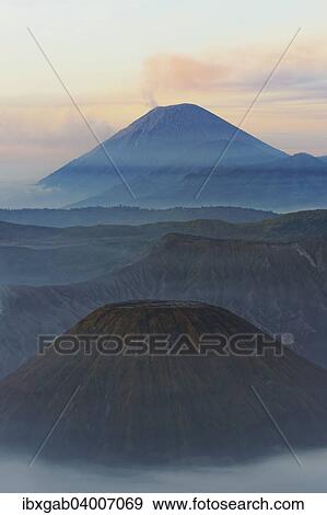 Stock Photo - "Sunrise over the smoking Gunung Bromo volcano, Bromo-Tengger-Semeru National Park, Java, Indonesia, Asia". Fotosearch